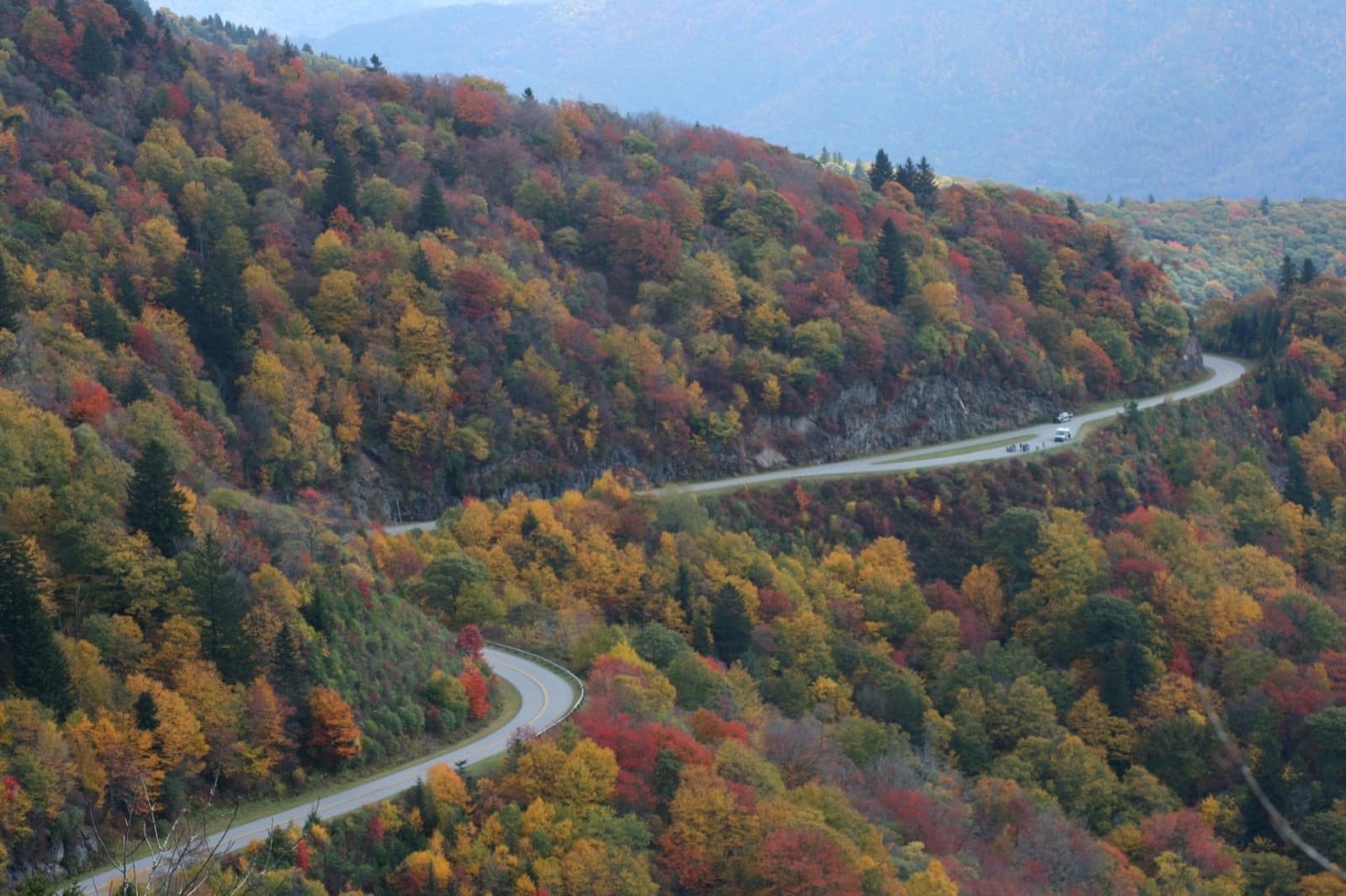 The parkway winding through mountainsides of red, orange and yellow trees