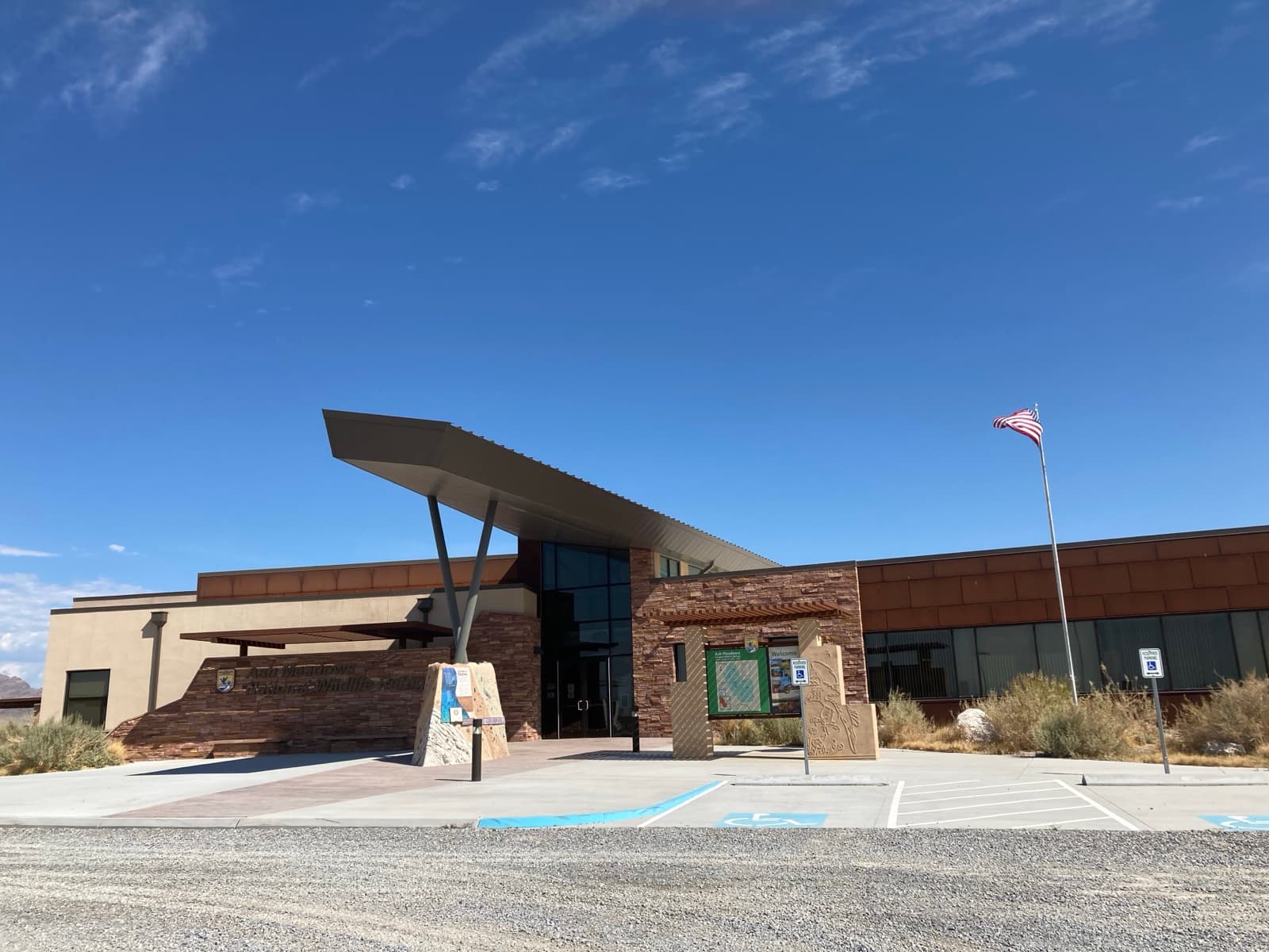 The Ash Meadows National Wildlife Refuge visitor center building in the desert.